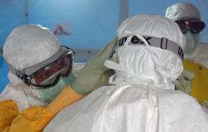 Preparing to enter an Ebola treatment facility. Source: CDC Global via Flickr.
